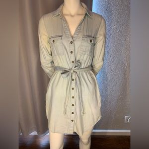 Light denim long sleeved button up dress with pockets and wrap belt